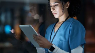 Shutterstock Scientist using a tablet.
